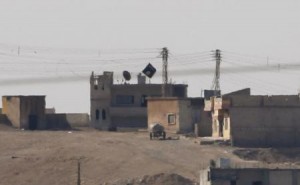 A black flag belonging to the Islamic State is seen in the Syrian town of Kobani, as pictured from the Turkish-Syrian border near the southeastern town