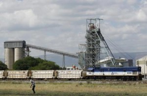 A man walks past a train carrying goods, at Anglo Platinum"s Khomanani shaft 1 mine in Rustenburg, northwest of Johannesburg