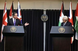 British Prime Minister David Cameron (L) gestures as he speaks during a joint news conference with Palestinian President Mahmoud Abbas in the West Bank town of Bethlehem 