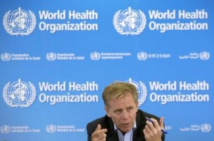 Bruce Aylward, World Health Organization assistant Director General in charge of the operational response on Ebola gestures during a news briefing at the WHO headquarters in Geneva