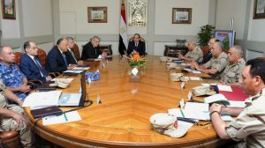 Egypt's President Abdel-Fattah el-Sissi, center, holds an emergency meeting of the National Defense Council with top officials after an attack in the Sinai Peninsula.