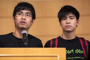 Hong Kong Federation of Students" Secretary-general Alex Chow (L) and Deputy Secretary-general Lester Shum attend a news conference after meeting with senior Hong Kong government officials in Hong Kong