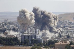 Smoke rises after an U.S.-led air strike in the Syrian town of Kobani