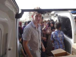 Abdul-Rahman (Peter) Kassig is pictured making a food delivery to refugees in Lebanon’s Bekaa Valley in this handout photo