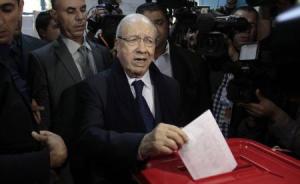 Beji Caid Essebsi, leader of Tunisia"s secular Nidaa Tounes party and a presidential candidate, casts his vote at a polling station in Tunis
