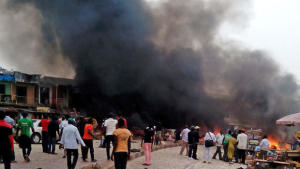Boko Haram attacks more Nigerian villages, killing dozens. Smoke rises after a bomb blast at a bus terminal in Jos, Nigeria