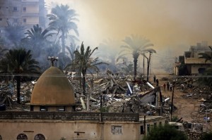Egyptians inspect their houses destroyed during a military operation by Egyptian security forces in Rafah near