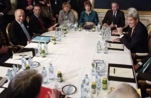 French Foreign Minister Laurent Fabius (L), EU envoy Catherine Ashton (4th L) and U.S. Secretary of State John Kerry (R) look towards Britain"s Foreign Secretary Philip Hammond during talks in Vienna