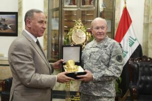 Iraq's Defence Minister Khaled al-Obeidi (L) meets with U.S. Army General Martin Dempsey, chairman of the Joint Chiefs of Staff, at the defence ministry in Baghdad