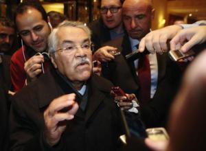 Saudi Arabian Oil Minister Ali al-Naimi gestures as he arrives at his hotel ahead of an OPEC meeting in Vienna