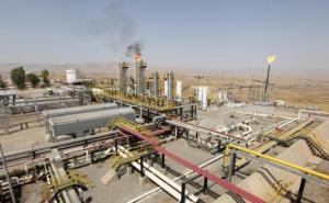 A flame rises from a chimney at Taq Taq oil field in Arbil