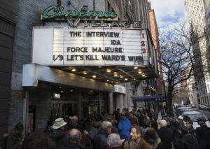 Patrons wait in line to see "The Interview" at the Cinema Village movie theater, Thursday, Dec. 25, 2014, in New York. The film's Christmas Day release was canceled by Sony after threats of violence by hackers linked to North Korea, but the release was reinstated in some independent theaters and through a variety of digital platforms.
