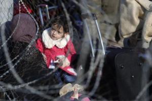 A Palestinian girl, hoping to cross into Egypt with her mother