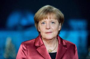 German Chancellor Angela Merkel poses for a photograph after the recording of her New Year's speech at the Chancellery in Berlin, Germany,