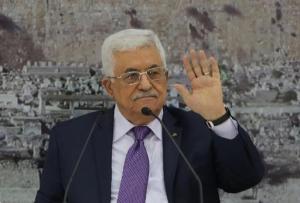 President Mahmud Abbas gestures during a meeting with Palestinian leaders in the West Bank city of Ramallah