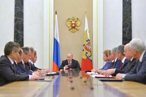 Russian President Vladimir Putin, center, heads the Security Council in Moscow's Kremlin