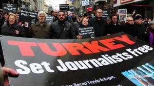 Turkish journalists march during a prote