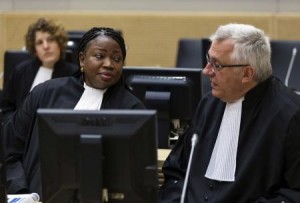 Prosecutor Fatou Bensouda (L) speaks with deputy prosecutor James Stewart in the courtroom of the International Criminal Court (ICC) during the initial appearance of Charles Ble Goude, a youth leader of the Ivory Coast, at The Hague