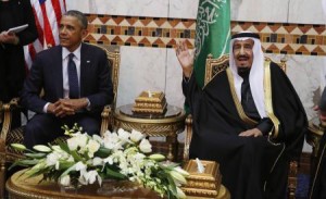 Saudi Arabia"s King Salman gestures to the media as he sits with U.S. President Barack Obama (L) at Erga Palace in Riyadh