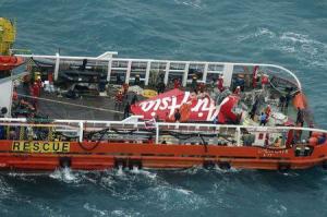 The tail of AirAsia QZ8501 passenger plane is seen on the deck of the Indonesian Search and Rescue (BASARNAS) ship Crest Onyx after it was lifted from the sea bed, south of Pangkalan Bun, Central Kalimantan