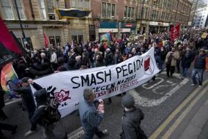 Demonstrators attend a counter-protest held adjacent to a protest by the UK branch of the Germany-based 'anti-Islamisation' PEGIDA group in the centre of Newcastle, northeast England