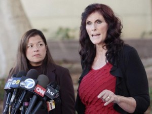 FILE - In this Thursday, Sept. 20, 2012, file photo, Cindy Lee Garcia, one of the actresses in "Innocence of Muslims," right, and attorney M. Cris Armenta hold a news conference in Los Angeles asking a judge to issue an injunction demanding a 14-minute trailer for the film be pulled from YouTube. A federal appeals court on Monday, May 18, 2015 overturned an order for YouTube to take down the anti-Muslim film that sparked violence in the Middle East and death threats to actors.