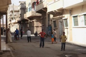 Residents walk in Palmyra city