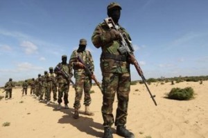 Members of Somalia"s Al Shabaab militant group parade during a demonstration to announce their integration with al Qaeda, in Elasha, south of the capital Mogadishu