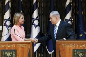 Israeli Prime Minister Benjamin Netanyahu (R) and European Union foreign policy chief Federica Mogherini shake hands during their meeting in Jerusalem