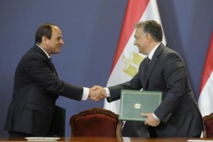 Egyptian President Abdel Fattah el-Sissi, left, shakes hands with Hungarian Prime Minister Viktor Orban during a signing ceremony in the Parliament building in Budapest, Hungary