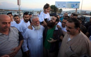 slamic Jihad leader Khader Adnan is greeted by his daughter upon his release from an Israeli jail, in the West Bank village of Arabeh near Jenin