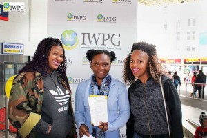 Woman showing her IWPG membership card