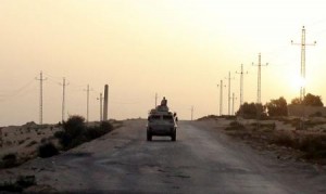 An Egyptian military vehicle is seen on the highway in northern Sinai, Egypt in this May 25, 2015 file photo. REUTERS/Asmaa Waguih/Files