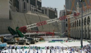 Muslim pilgrims walk past a crane that collapsed the day before at the Grand Mosque in Saudi Arabia's holy Muslim city of Mecca,