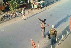Taliban fighters walk in the Afghan city of Kunduz 