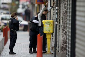 Nov A resident is being searched by police officers in Paris suburb Saint-Denis