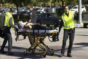 Rescue crews tend to the injured in the intersection outside the Inland Regional Center in San Bernardino, California in this still image taken from video 