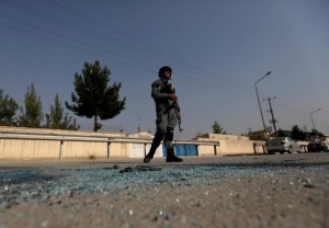 An Afghan policeman stands guard after an attack at the American University of Afghanistan in Kabul, Afghanistan  