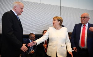 German Chancellor Angela Merkel and Interior Minister Horst Seehofer arrive for a CDU/CSU fraction meeting in Berlin, Germany